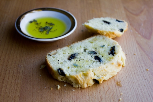 Use your favorite types of olives in this bread. And when serve it warm with a shallow plate of olive oil sprinkled with fresh-cracked pepper, course salt and herbs.
